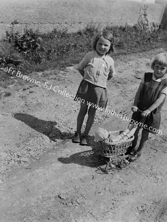 GIRL WITH DOLL'S PRAM